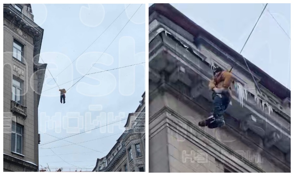 Дворник упал с крыши и повис на проводах